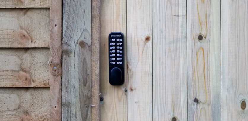 Keyless code lock on a wooden gate